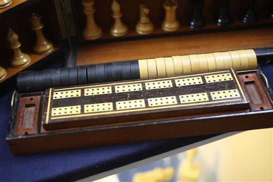 A Victorian amboyna games compendium, width 13in. height 7.5in.